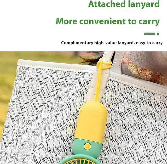 Portable mini fan with attached lanyard for easy carrying, perfect for on-the-go cooling