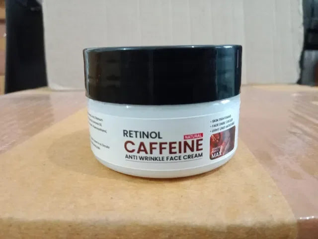 Retinol caffeine anti-wrinkle face cream jar with black lid on wooden surface