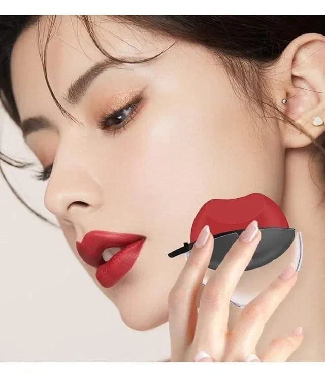 Woman applying red lip-shaped makeup sponge for flawless lipstick application