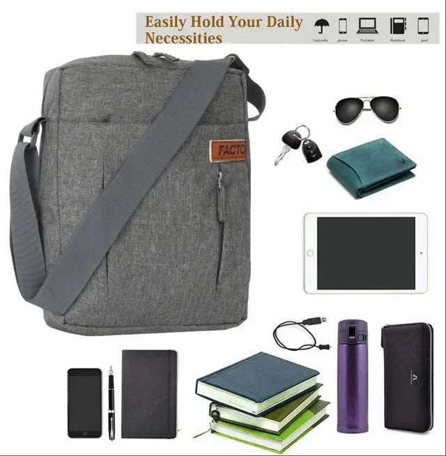 Gray crossbody messenger bag with adjustable strap, holding daily essentials like tablet, books, wallet, and phone